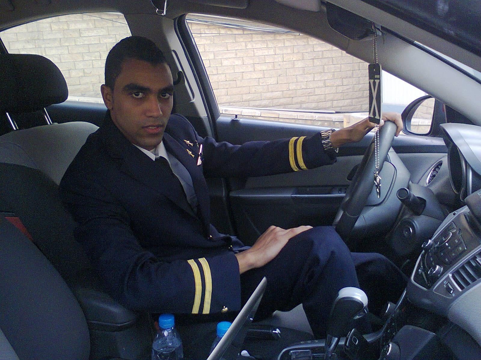Retained photograph of the subject in a dark pilot uniform