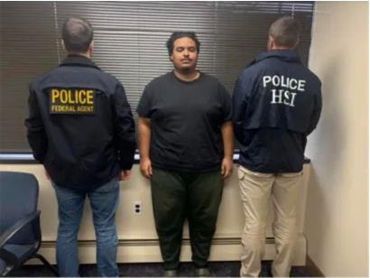 DHS photo of Emilio Roman-Flores standing between two HSI agents